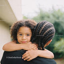 Young child embracing sibling with calm expression