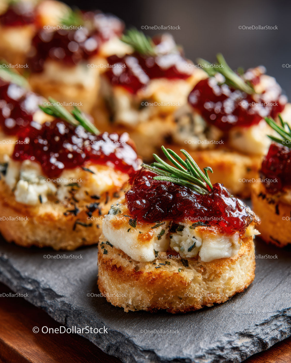 Gourmet Crostini with Blue Cheese Raspberry Jam and Rosemary Garnish