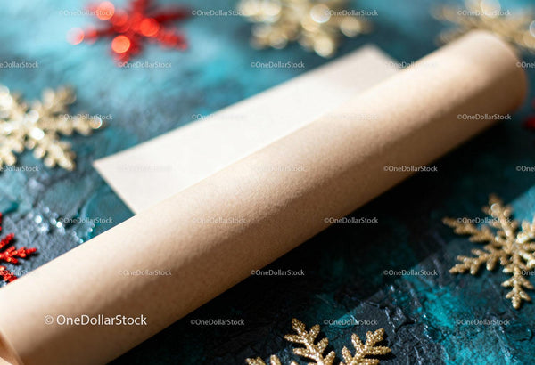 Craft paper roll with festive golden snowflakes background
