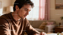 Thoughtful man focusing on work at home desk
