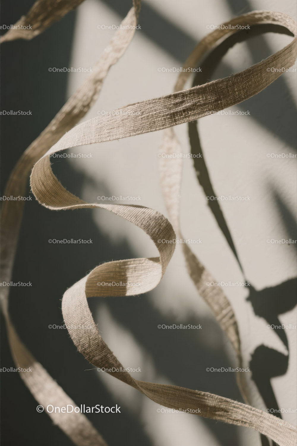 Close-up of White Plastic Ribbon Waste on Sandy Beach