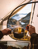 Enjoying Hot Noodles Inside a Mountain Tent at Sunrise