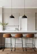 Minimalist Modern Kitchen with Brown Leather Bar Stools and Black Pendant Lights