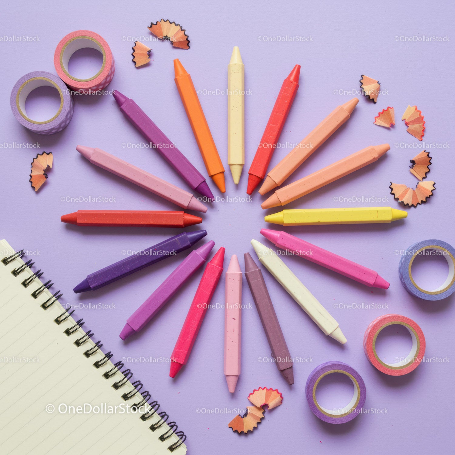 Colorful pastel crayons arranged in circular pattern
