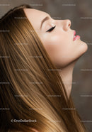 Side profile of woman with long silky hair and closed eyes