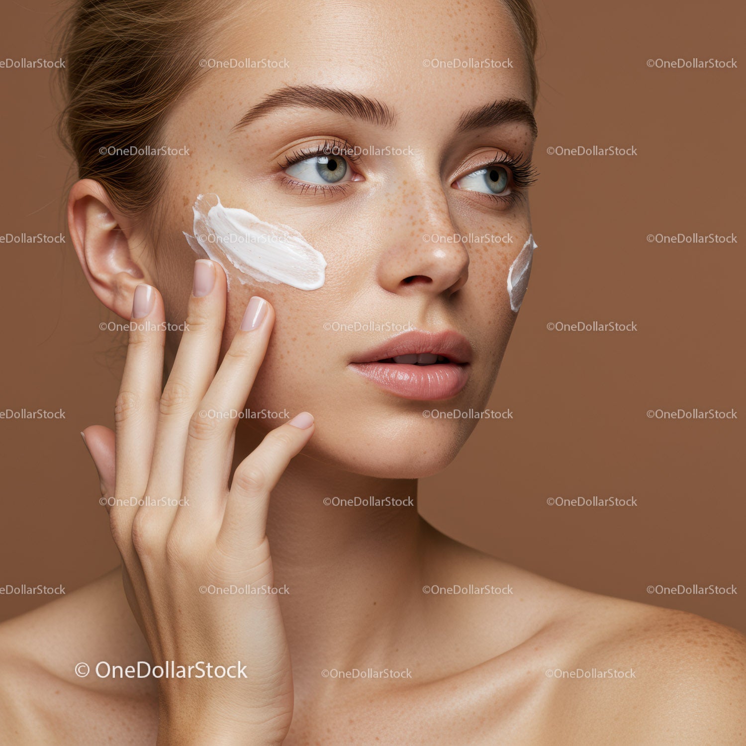 Close-up of Young Woman Applying Cream for Skincare Routine