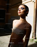 Confident woman with bold makeup in natural sunlight