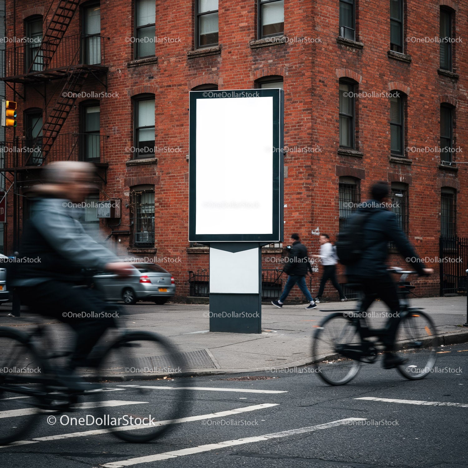 Urban street scene with cyclists and empty billboard