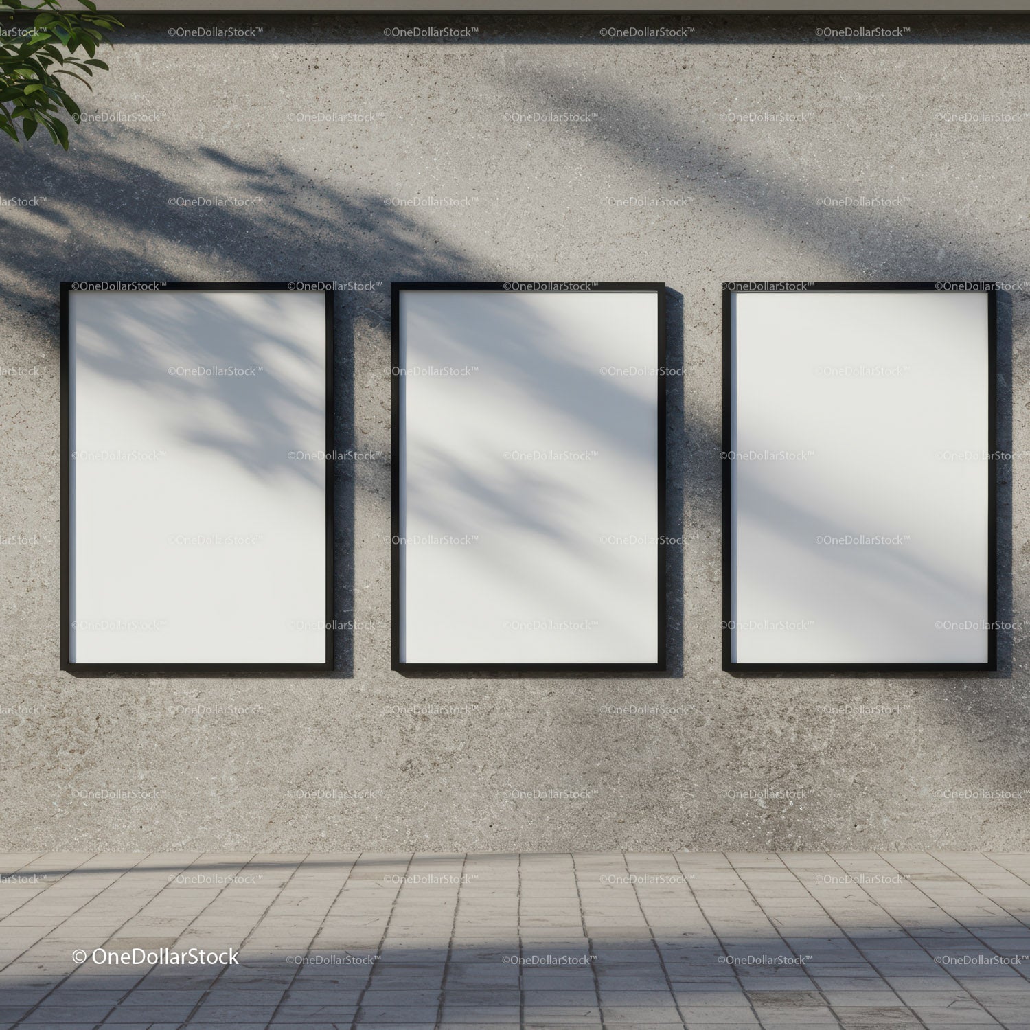 Three blank posters hanging on textured concrete wall