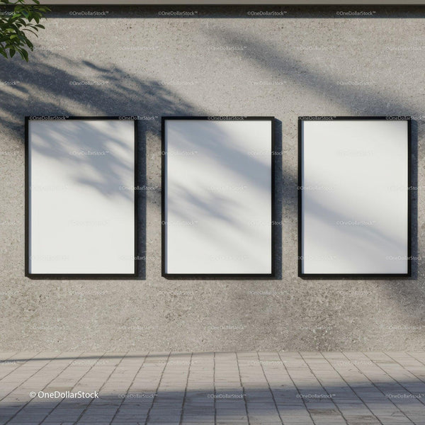Three blank posters hanging on textured concrete wall JPG Mockup Image