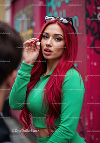 Vibrant Red Hair Woman in Green Tracksuit with Sunglasses in City