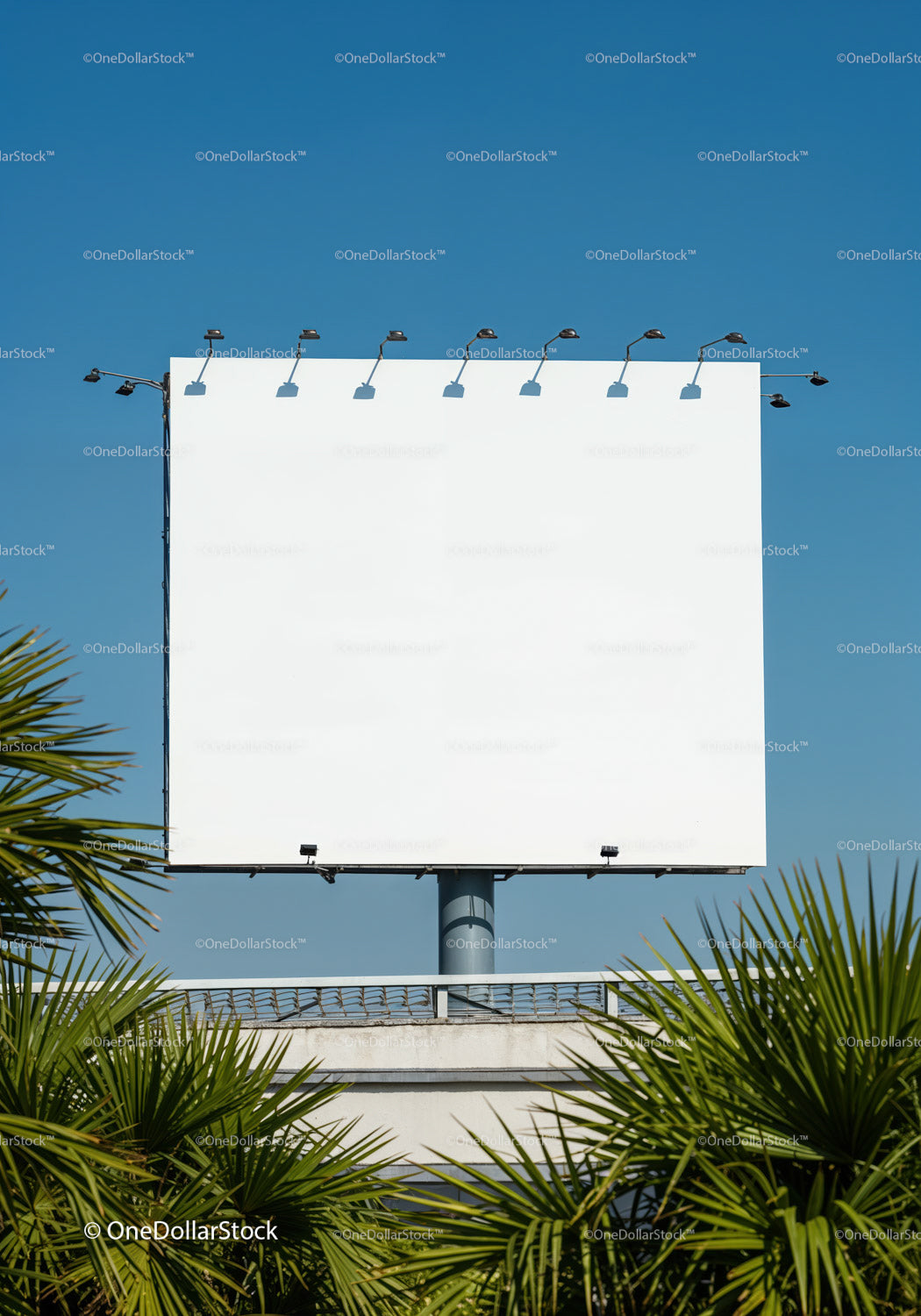Empty white billboard against clear blue sky