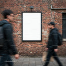 Blank advertising board on brick wall with blurred pedestrians