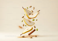 Floating pear slices with pistachios and cinnamon sticks