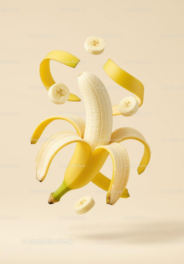 Peeled banana with floating slices and peel spirals