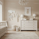 Elegant Nursery Room with White Dresser and Cloud Wall Decor