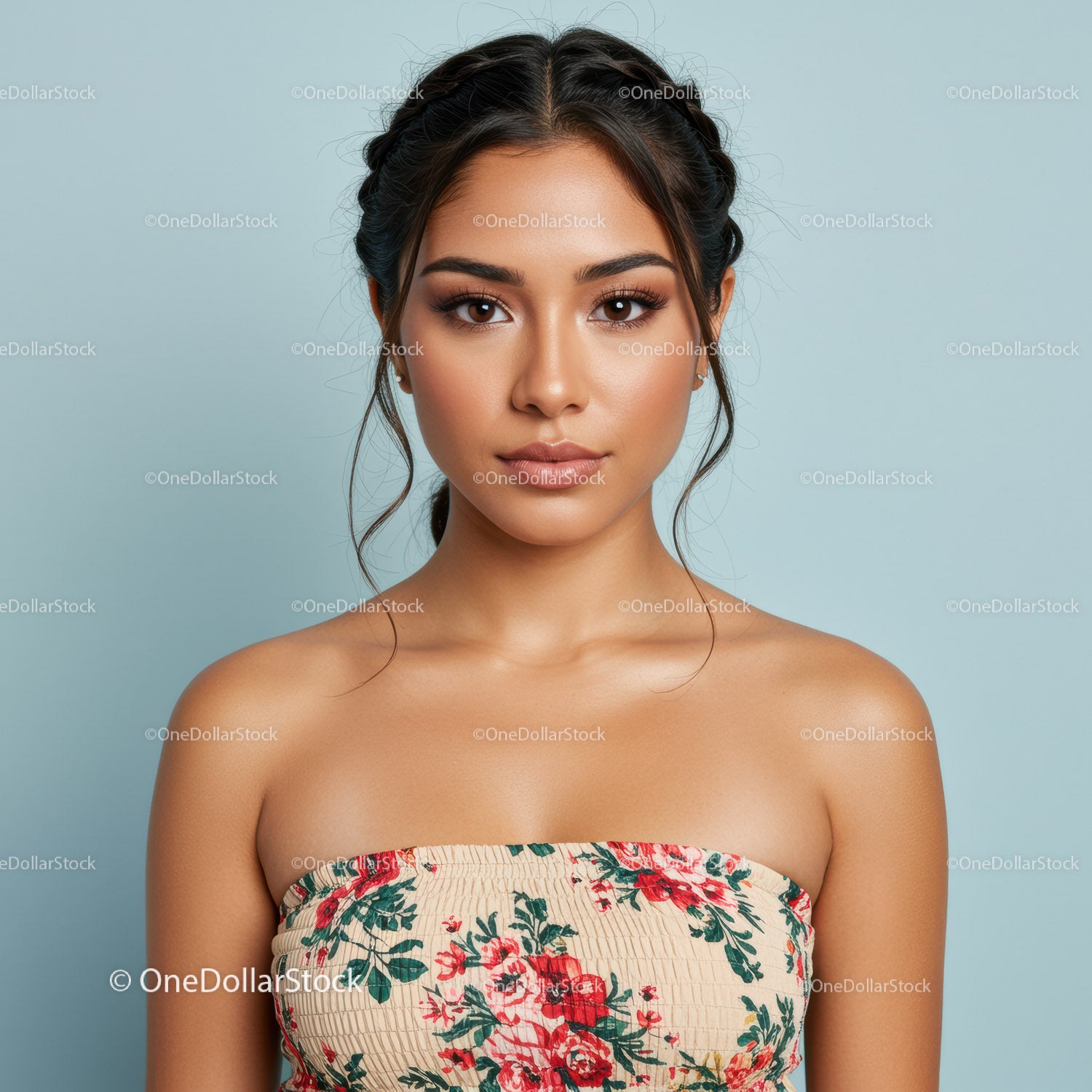 Beautiful Woman with Braided Hair and Floral Top in Studio Portrait