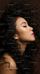 Profile of woman with flowing curly hair and pink lips