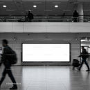 Modern transit station with blank illuminated billboard