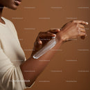 Close-Up of Woman Applying Sunscreen Lotion on Arm for Sun Protection