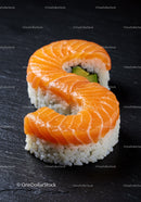 Salmon Sushi Roll Shaped Like Letter S on Black Plate