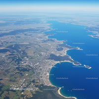 Scenic Coastal City with Blue Lake and Curving Shoreline