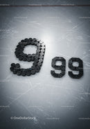 Hockey Pucks Arranged as Number Ninety on Ice Rink