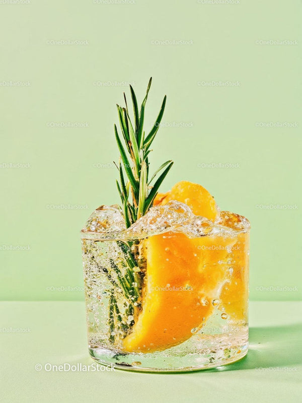Refreshing Citrus Cocktail with Rosemary Garnish