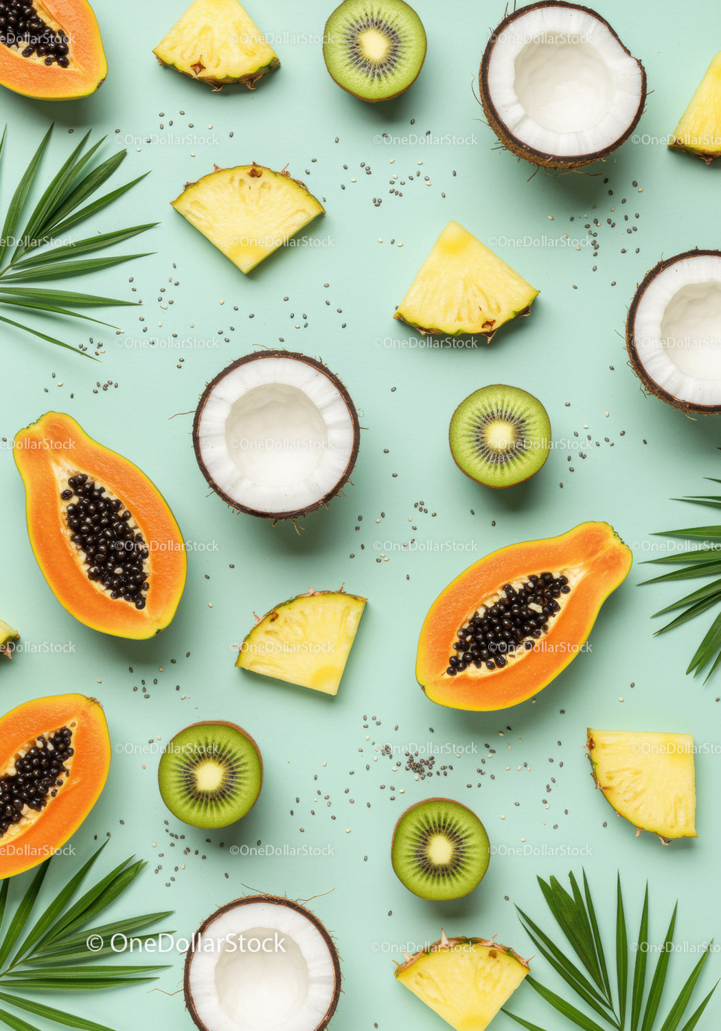 Tropical fruit assortment with coconut and palm leaves