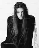 Elegant Monochrome Portrait of a Woman with Long Hair and Intense Expression