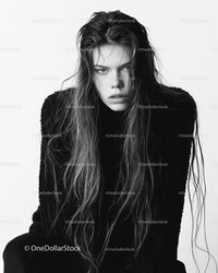 Elegant Monochrome Portrait of a Woman with Long Hair and Intense Expression