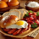Hearty English Breakfast with Fried Egg Bacon Sausage and Strawberries