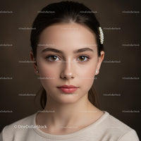 Elegant Female Portrait with Brown Eyes and Pearl Hairpin
