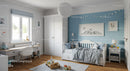 Cozy Children's Bedroom with Blue Accent Wall and Playful Decor