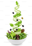 Fresh green salad with cucumber spiral and olives