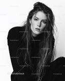 Black and White Portrait of a Woman with Wet Hair and Intense Expression