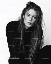 Black and White Portrait of a Woman with Wet Hair and Intense Expression