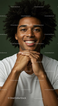 Confident Smiling Man with Curly Hair in Studio Portrait