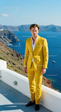 Man in Yellow Suit Standing by Coastal Cliffside View