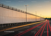 City Highway with Light Trails During Sunset in Urban Environment