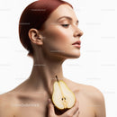 Elegant Beauty Portrait with Fresh Pear and Red Hair in Soft Lighting