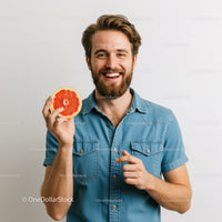 Smiling Man Holding Fresh Grapefruit Relaxing Indoors