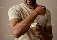 Man Applying Body Lotion on Arm for Skincare and Moisturization