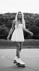 Young woman enjoying roller skating outdoors in summer