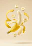 Sliced and Peeled Banana Floating in Soft Light