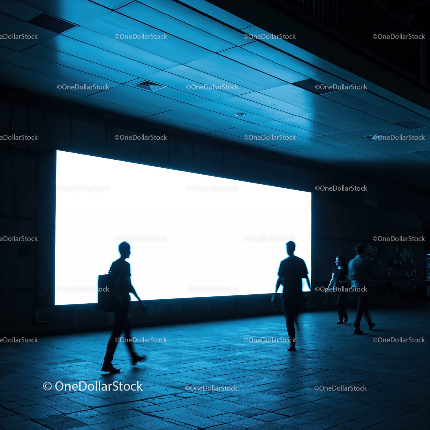 Silhouettes Walking Near Bright Urban Billboard at Night