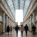 Couples walking hand in hand through shopping gallery