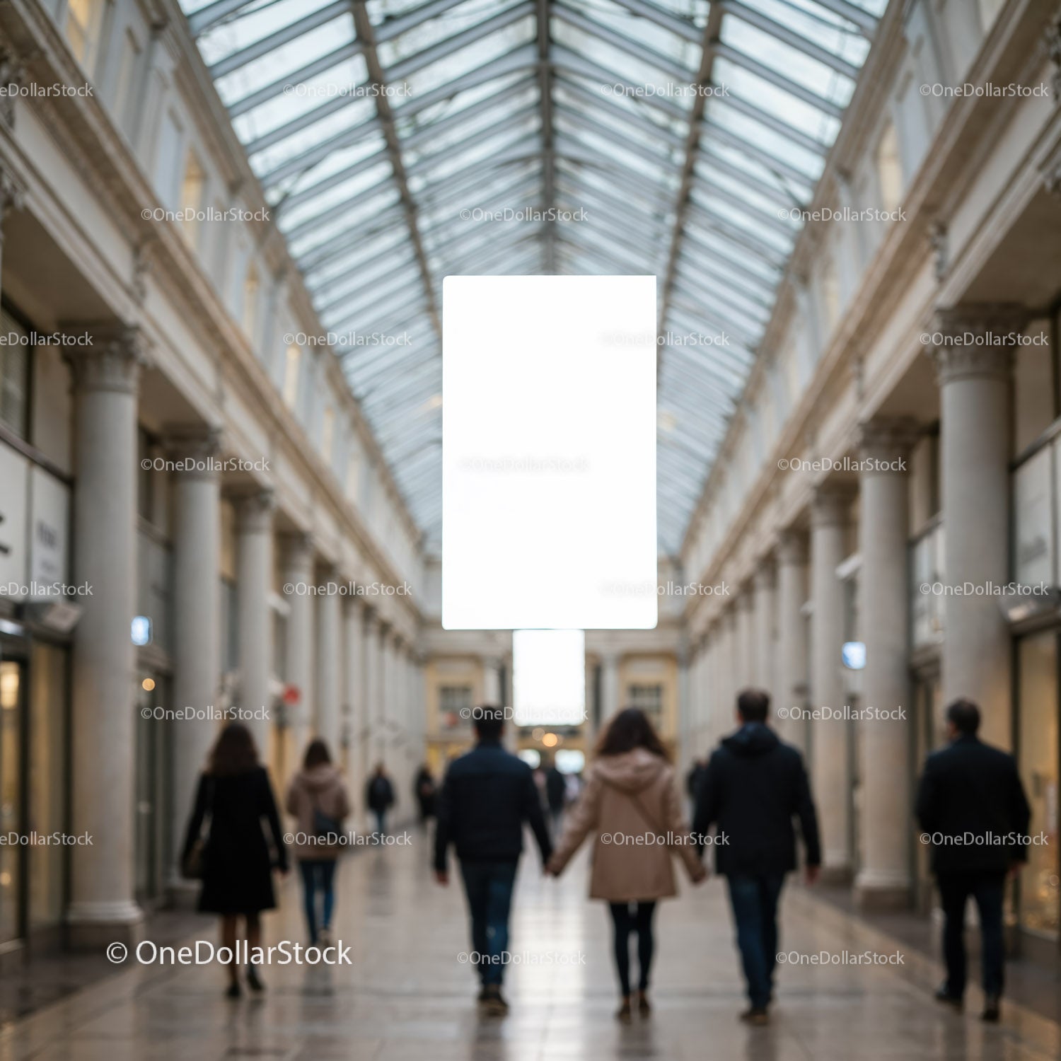 Couples walking hand in hand through shopping gallery