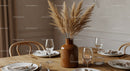 Elegant Dining Table with Pampas Grass Vase and Modern Glassware Setup