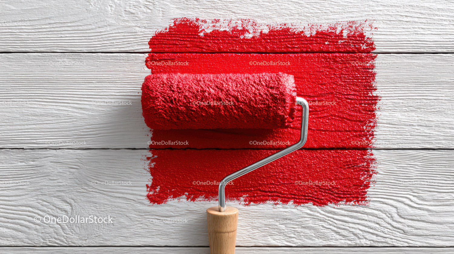 Red Paint Spread on White Wooden Surface with Roller Tool